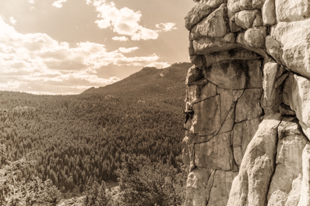 Climber on a sheer cliff